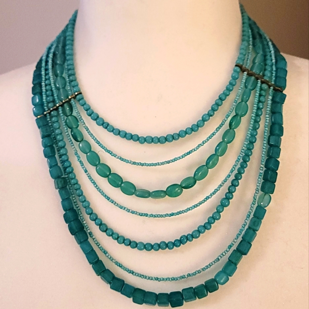 Turquoise multi-strand bead necklace.